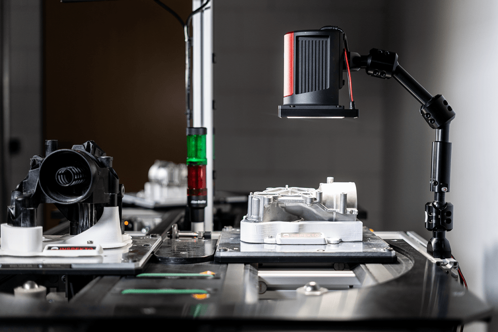 "Inspekto Computer Vision System inspecting metal part"